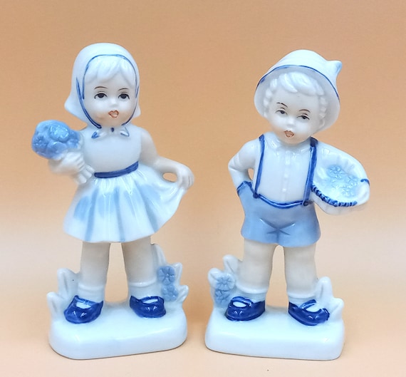Couple of vintage ceramic FIGURINES, boy and girl, blue and white, bouquet of flowers, basket, porcelain