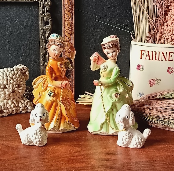 Vintage figurine of a woman walking her dog on a leash, lady with a poodle, vintage porcelain