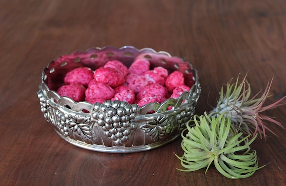 Silver-plated metal bowl by Silea, very elaborate, with a grape and vine leaf motif.