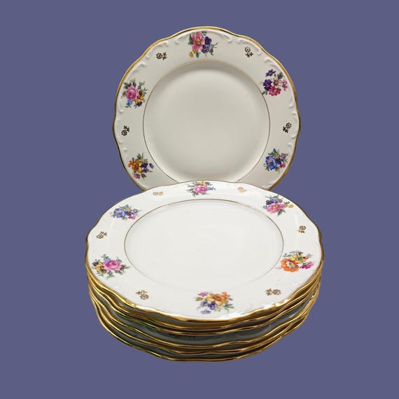 7 dessert plates with flower motif, Limousin porcelain, France