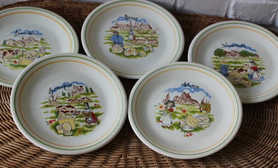 5 individual cheese plates, French dessert plates and decorations representing the regions of France