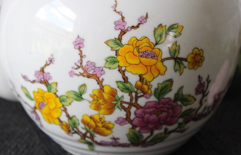 Japanese-style teapot with branch pattern trimmed with yellow and vintage roses