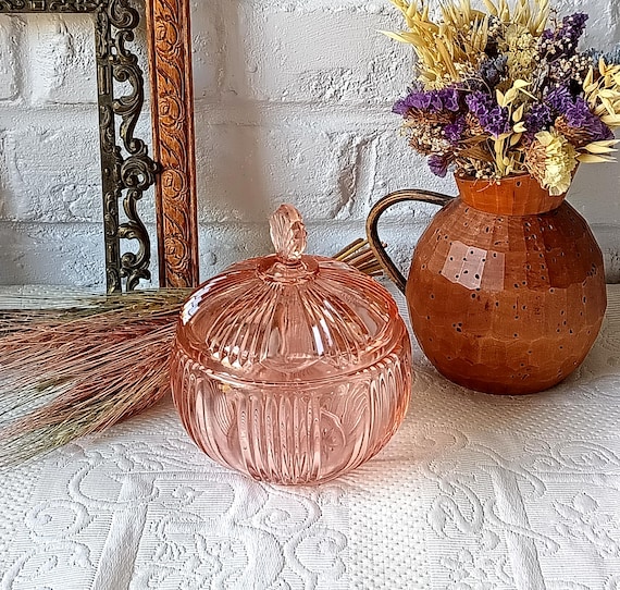 Pink colored glass candy dish, sugar bowl, jewelry box