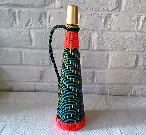 Scoubidou bottle with handle, braided in Scoubidou plastic thread. Vintage