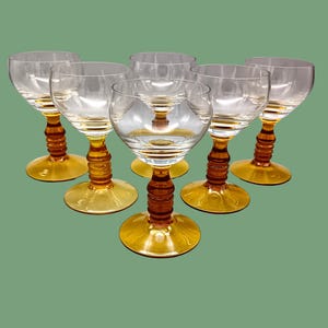 6 vintage GLASSES in transparent glass and amber foot