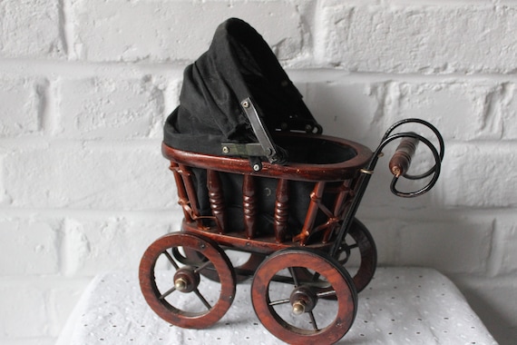 Beautiful miniature vintage Victorian stroller, a display piece