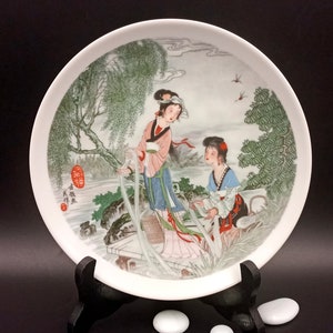 Vintage porcelain plate with Asian landscape motif