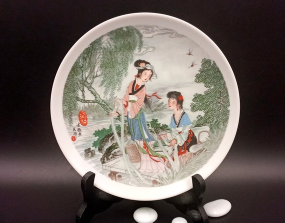Vintage porcelain plate with Asian landscape pattern