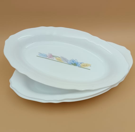 3 Arcopal oval serving bowls with stylized flower pattern