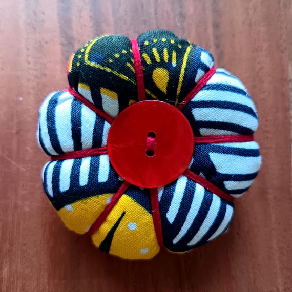 Pumpkin-shaped fabric brooch, hand-sewn