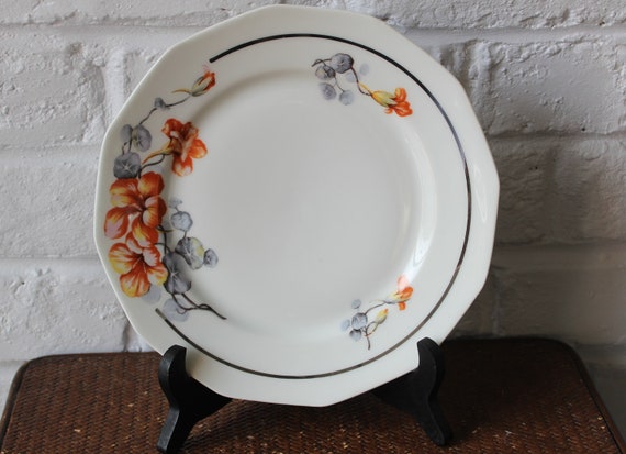6 or 5 flat porcelain PLATES with orange and gray nasturtium pattern