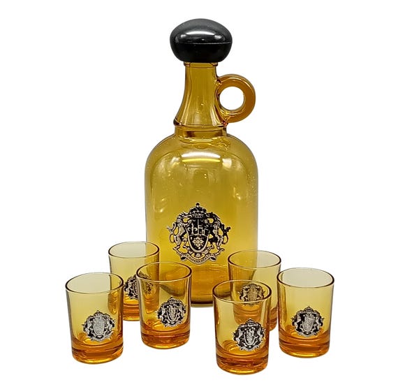 Old Liqueur Service in colored glass, vintage amber yellow carafe