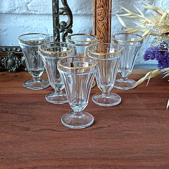 Antique stemmed liqueur glasses with gold rim, early 20th century, antique French shot glasses.