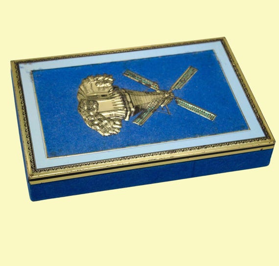 Old metal box in blue felt with vintage mill decor