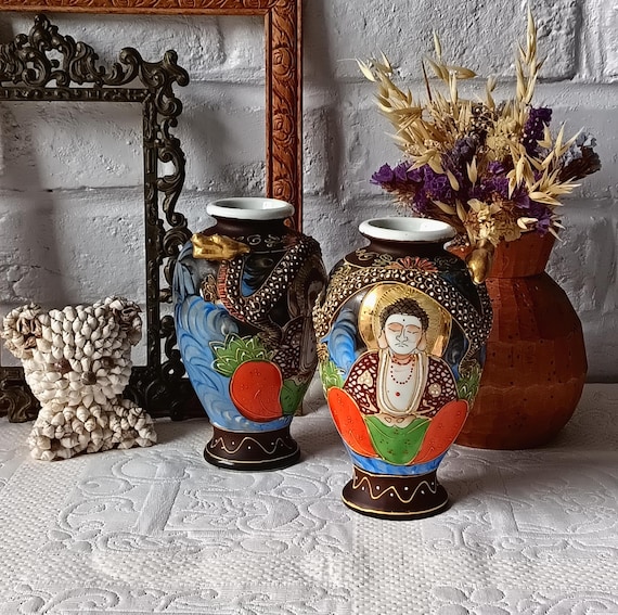 Pair of Japanese ceramic vases, 1970s, with dragon and Buddha motif