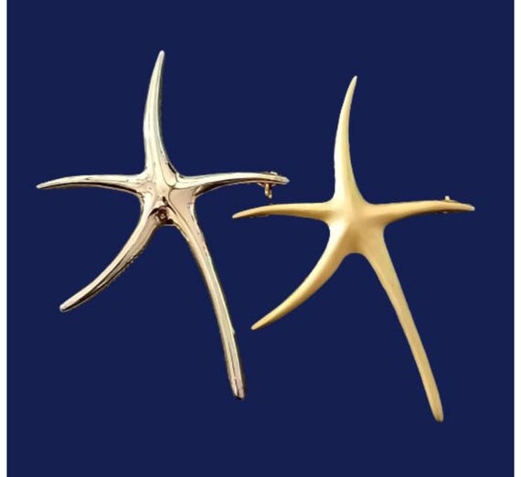 Vintage gold star brooch
