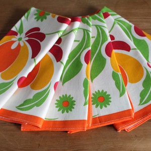 6 cotton and viscose napkins with orange flower patterns on a white background, vintage 70s