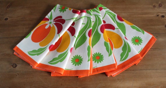 6 cotton and viscose napkins with orange flower patterns on a white background, vintage 70s