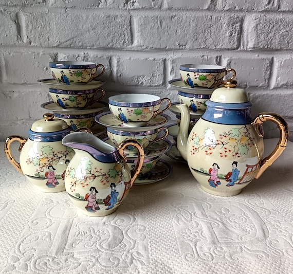 Vintage Japanese fine porcelain coffee cups with landscape motif