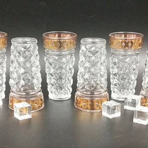 Transparent liquor glasses with vintage gold decor, vodka glass