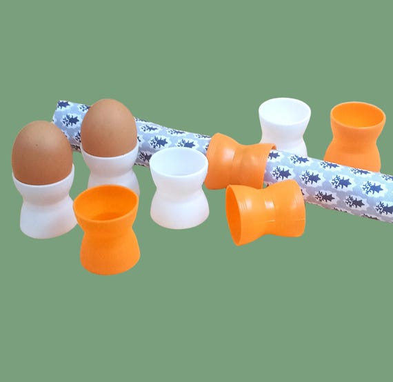 8 vintage orange and white plastic diabolo egg cups
