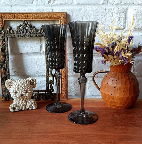 2 vintage champagne flutes in grey colored glass
