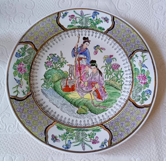 Porcelain plate, Japanese decoration, couple on the edge of a river