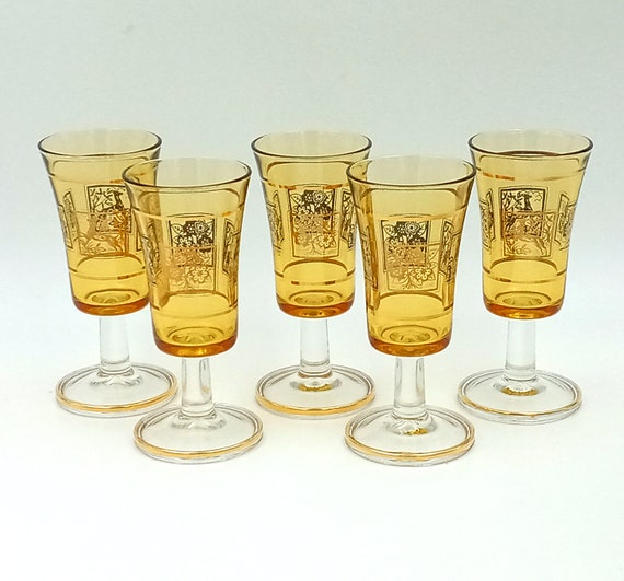 5 vintage yellow liqueur glasses with gold pattern