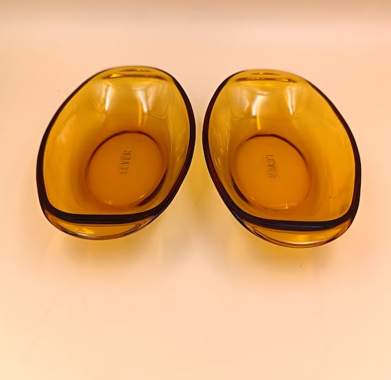 Two vintage amber-colored tempered glass dishes, Lever appetizer platters