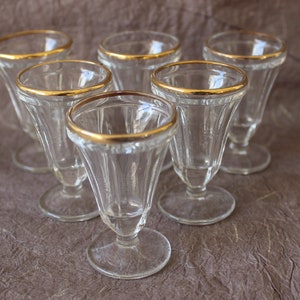 Antique liqueur glasses with stems and gold rim, early 20th century, antique French shot glasses,