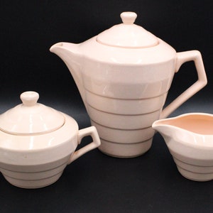 Powder pink coffee pot, sugar bowl and creamer Ceranord St Armand France