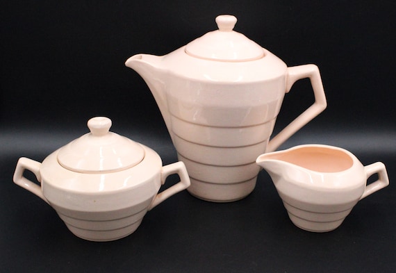 Powder pink coffee pot, sugar bowl and creamer Ceranord St Armand France