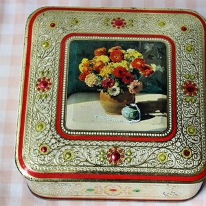 Vintage metal box with imitation precious stones and gold in relief with vintage baroque decoration