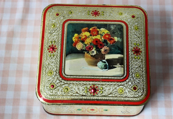 Vintage metal box with imitation precious stones and gold in relief with vintage baroque decoration