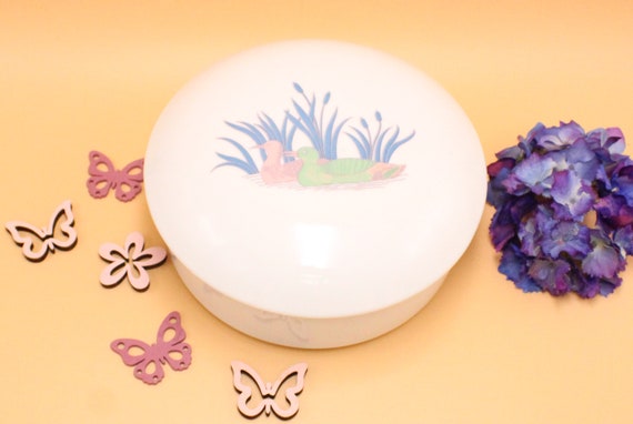 Large round porcelain box with lid, decorated with ducks