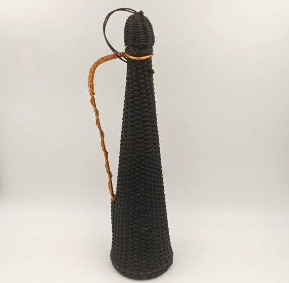 Vintage 1950s glass bottle decorated with black scoubidou cords, gold metal handle