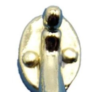 May include: Two gold-toned door handles with a keyhole and a rounded design. The handles are oval-shaped and have a smooth, polished finish.