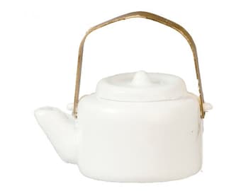 May include: A small, white ceramic teapot with a matching lid and a gold-colored handle. The teapot has a spout and a rounded body, perfect for serving tea. The handle is attached to the sides of the teapot.