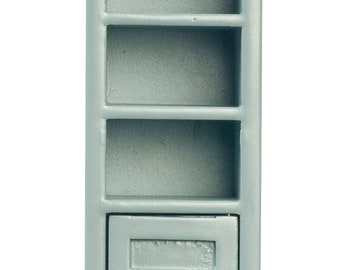 May include: A tall, light blue wooden cabinet with four shelves and a single door. The cabinet has a simple design with a small knob on the door.