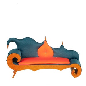 May include: A teal blue and orange chaise lounge with a unique, whimsical design. The chaise has a curved wooden frame and a plush, padded seat and back.