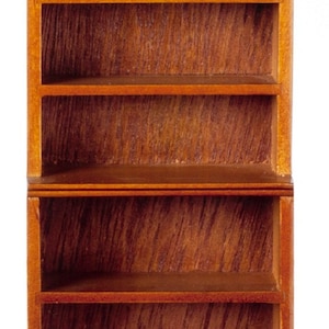 May include: A wooden bookcase with five shelves. The bookcase is made of a dark brown wood with a light brown stain. The shelves are empty.