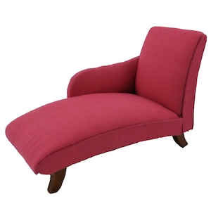 May include: A pink chaise lounge with wooden legs. The chaise lounge is upholstered in a soft, plush fabric.