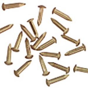 May include: A scattering of small, brass-coloured upholstery tacks on a white backdrop. Each tack features a rounded head and a pointed tip, used for attaching fabric to furniture.