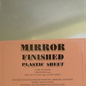 May include: A sheet of silver mirror-backed plastic, suitable for dollhouse windows, mirrors, and hobby applications. The sheet is 297 x 210 mm, or approximately A4 size. The text on the sheet reads "Mirror Finished Plastic Sheet, Code: PC0100M, Thickness 1mm, Size: 297 x 210mm app. A4 Size Sheet, Suitable for dollhouse windows, mirrors, and most hobby applications. Material: Silver mirror backed plastic. Please note: Remove the plastic protective sheet which is on both sides, which stops the plastic sheet from getting damaged or scratched."