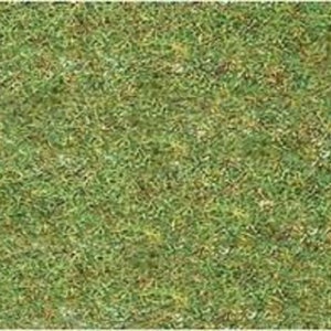 Può includere: Primo piano di una superficie testurizzata verde, marrone e gialla che ricorda l'erba.