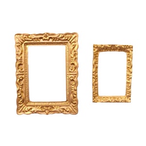 May include: Two ornate gold picture frames, one larger than the other, with intricate details and a slightly distressed finish.