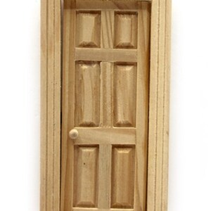 May include: A wooden door with a simple design, featuring a raised panel pattern and a single knob. The door is unfinished and ready to be painted or stained.