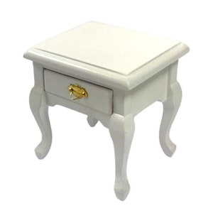 May include: White wooden bedside table with a single drawer and gold-coloured hardware. The bedside table has four legs with a curved design.