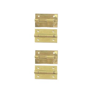 May include: Four gold-toned hinges, each with two small holes for attaching to a surface. The hinges are arranged vertically in a row.