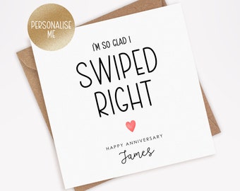 May include: White card with black text that reads "I'm so glad I swiped right."  A small pink heart is below the text.  The text "Happy Anniversary James" is below the heart.